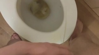 Skinny teen pissed in the toilet and on the toilet seat then he licks it up