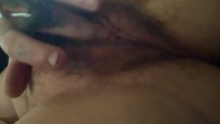 Horny tattooed girl plays with her wet pussy