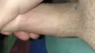 Jerking off in bed with a thick cock and cumming