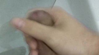 Cumming bathroom jerking cock 