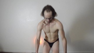 Cam Crest Works out with Dumbbells in a Thong