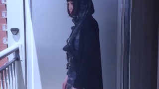 Hari smokes on her balcony