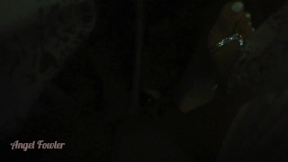 Girl Peeing in darkness into tropical river after sunset - Angel Fowler
