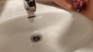Peeing in the sink with creampied pussy
