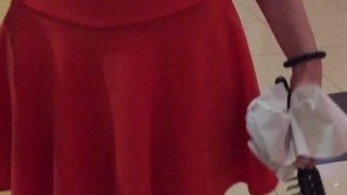 Public upskirt in a skirt without panties in a cinema lobby