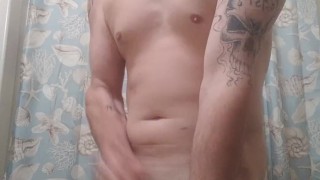 I'm in the bathroom Stripping my clothes off and playing with my cock haed 