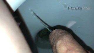 Pissing in a dirty public toilet