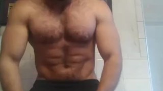 Muscular bodybuilder nude flexing and jerking off