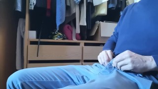 Jerking off sitting on a chair in a dressing room 