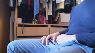 Jerking off sitting on a chair in a dressing room 