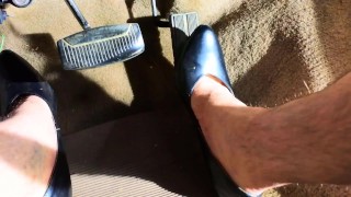 Pedal pumping crossdresser in high heels Stalled car