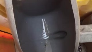 Taking a leak in the Port a Potty 