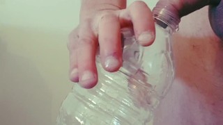 desperate twink pissing in a bottle