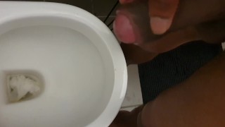 Pissing. Black dick urinal piss and wank
