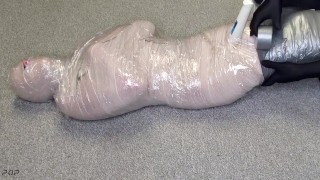 Harley Quinn wrapped in layers of mummification bondage then teased with a wand & made to cum
