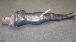 Harley Quinn wrapped in layers of mummification bondage then teased with a wand & made to cum