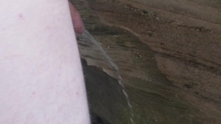 Skinny Guy pissing at a public nude beach 
