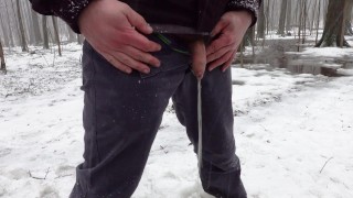 Peeing in the woods during snowfall