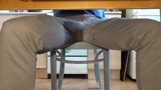 Pissing in jeans under the table