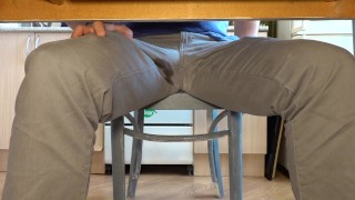 Pissing in jeans under the table