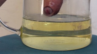 Huge peeing in a bowl