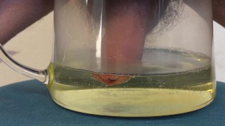 Huge peeing in a bowl