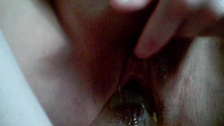 Close up of me shoving a glass beer bottle in my shaved smooth pussy