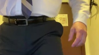 A man in a suit ejaculates in the office1