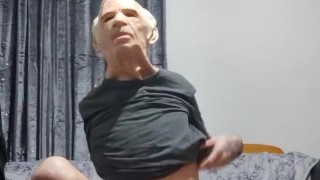 Very skinny teen puts on an old man face on himself and shows off his body while in briefs