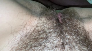 He licked the hairy pussy of his girlfriend close up and she finished with pleasure