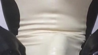 Handjob wearing latex catsuit with latex sheath inside