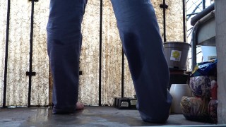 Desperate pee in jeans on the balcony