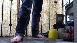 Desperate pee in jeans on the balcony