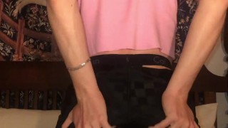 Jesse Gold plays around in a crop top, headband, and thong