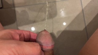 Massive urination of a muscular man