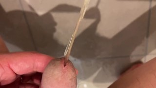 Massive urination of a muscular man