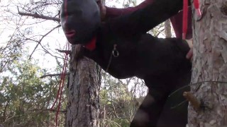 Tied up to a tree outdoor on sexy clothes, wearing pantyhose and high ankle boots heels, rough fuck