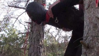 Tied up to a tree outdoor on sexy clothes, wearing pantyhose and high ankle boots heels, rough fuck