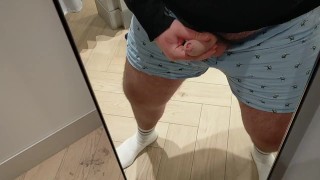 A very risky wank in the changing room!