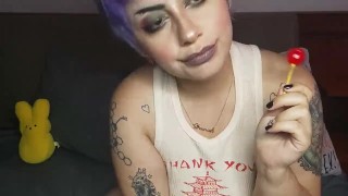 Sucking a lollipop