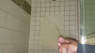 Penis Envy. Shooting his piss all over in the hotel shower! Holding his dick while he pees.