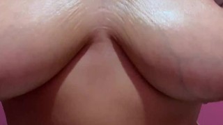 Lonely BBW massages oily breasts.