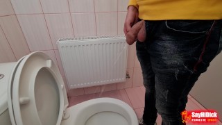 Uncircumcised cock pees on the station toilet