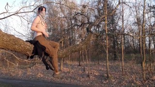 Girl undresses in nature