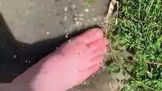 Feet playing in a puddle