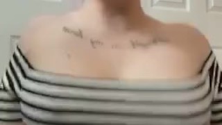 Tattooed alt girl shakes and plays with her boobs