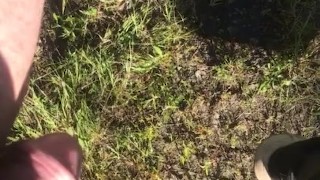 Peeing off tailgate outdoors 