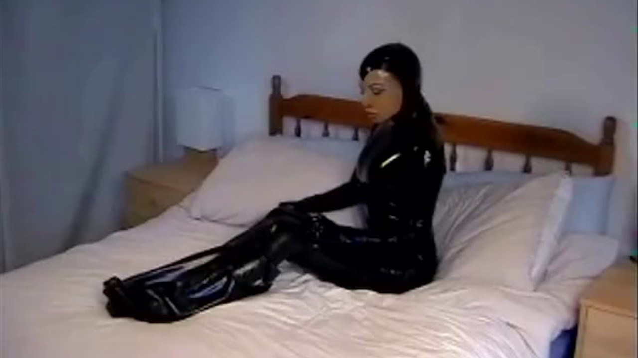 Cute girl in black latex catsuit with mask makes self bondage in rubber  vacuum sleepbag - part 1