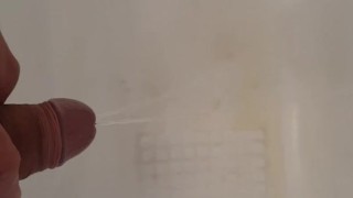 Hot man peeing in the tub with a boner double stream