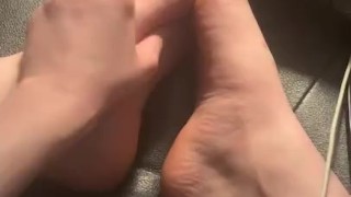 Rubbing feet and taking off socks
